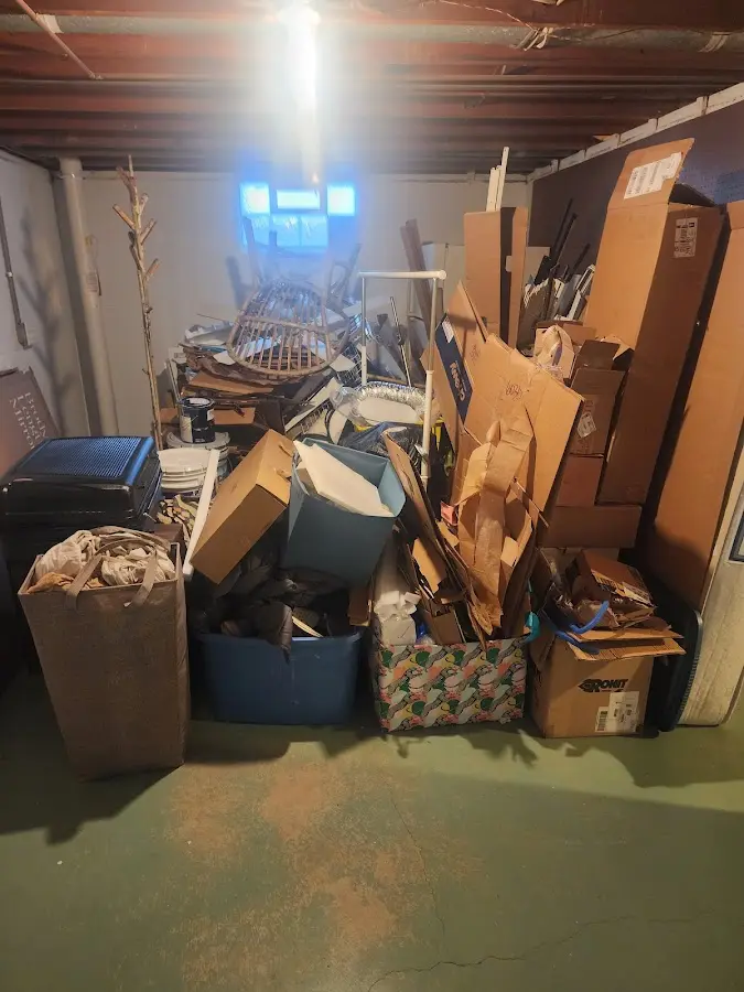 Roll-off dumpster container at job site for 6 Yard Dumpster Rental in Ossipee