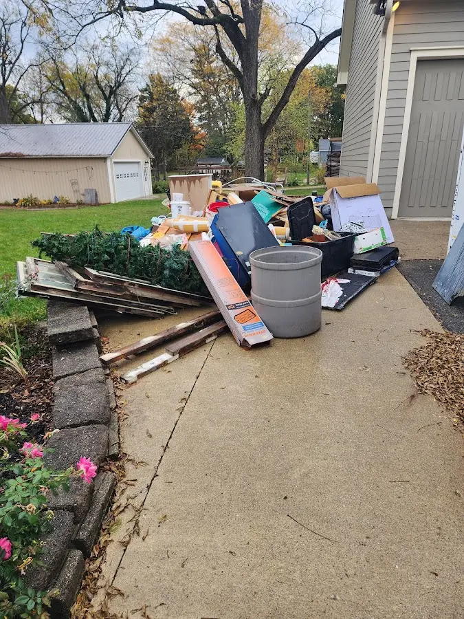 Dumpster being loaded with debris for Residential Dumpster Rental in Ossipee